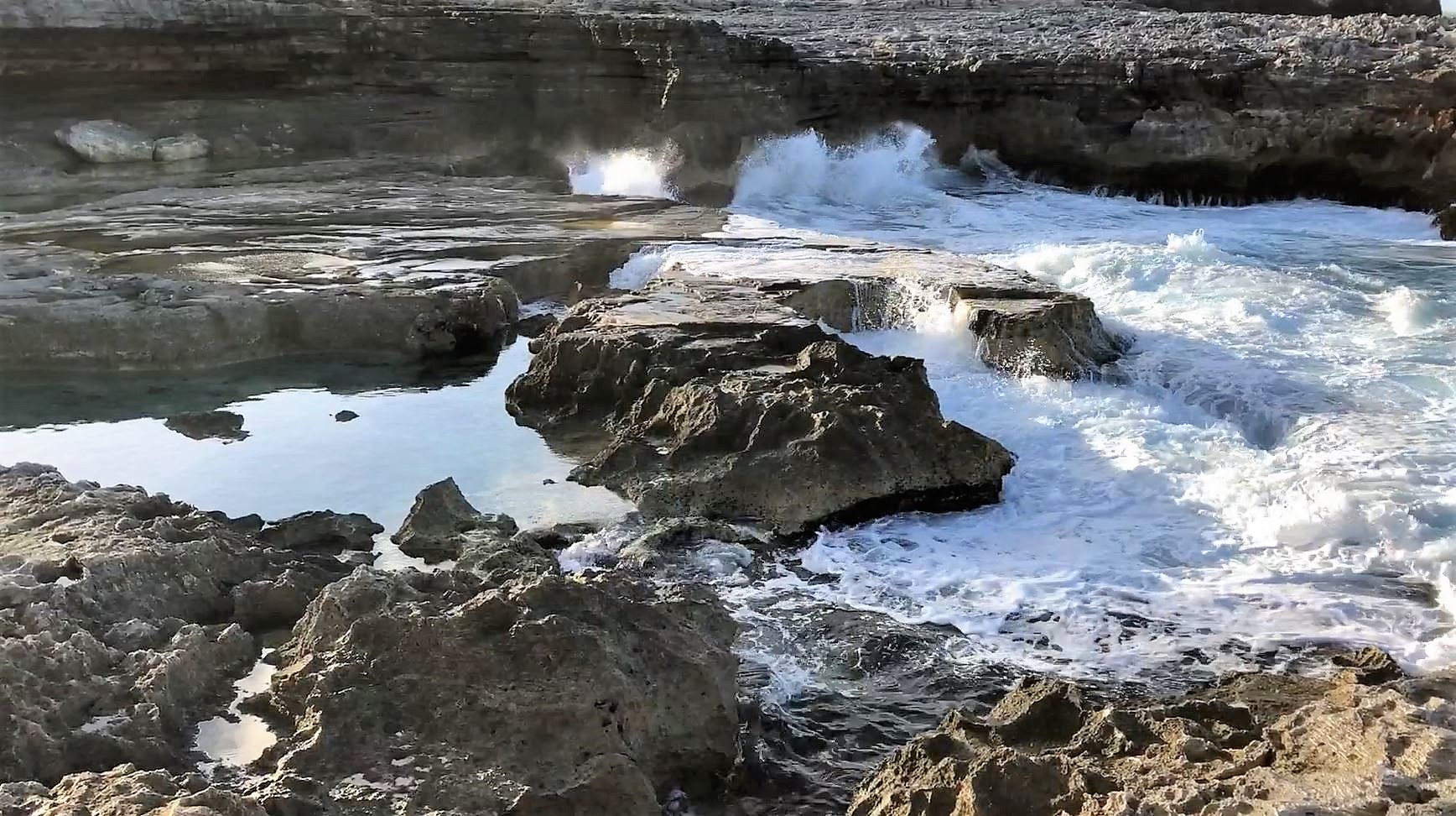 Water fills the eroded limestone cavities