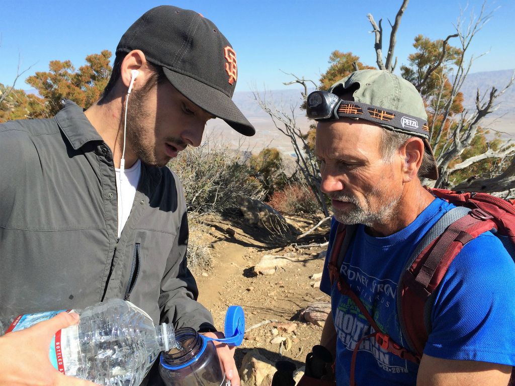 10:51 hrs - Bruce discovers he is missing a quart-sized water bottle, which probably fell out of his pack at the bathroom break. Brett is carrying a gallon of water so he tops off his remaining bottle.