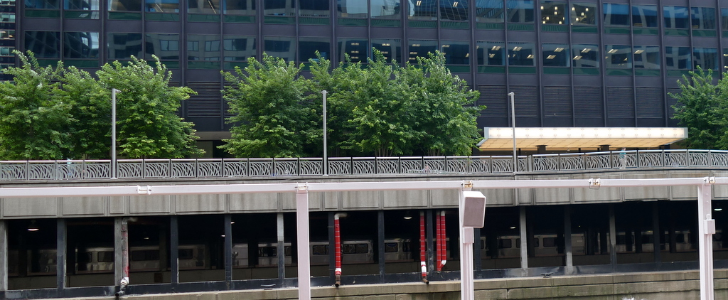 Trains under buildings.