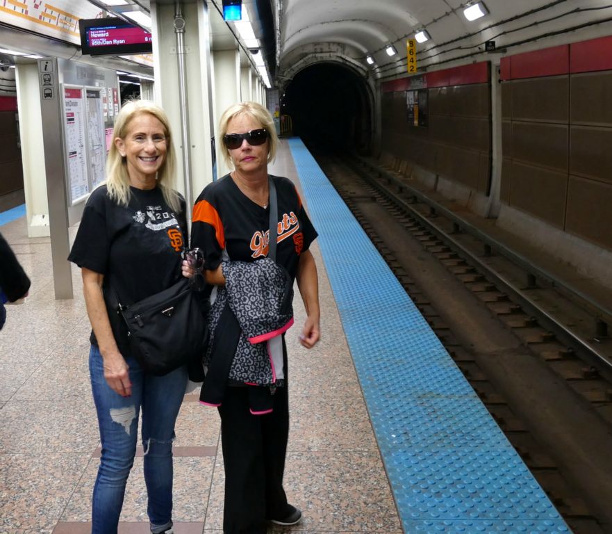 Takiing the 'L' train to the Cubs game.