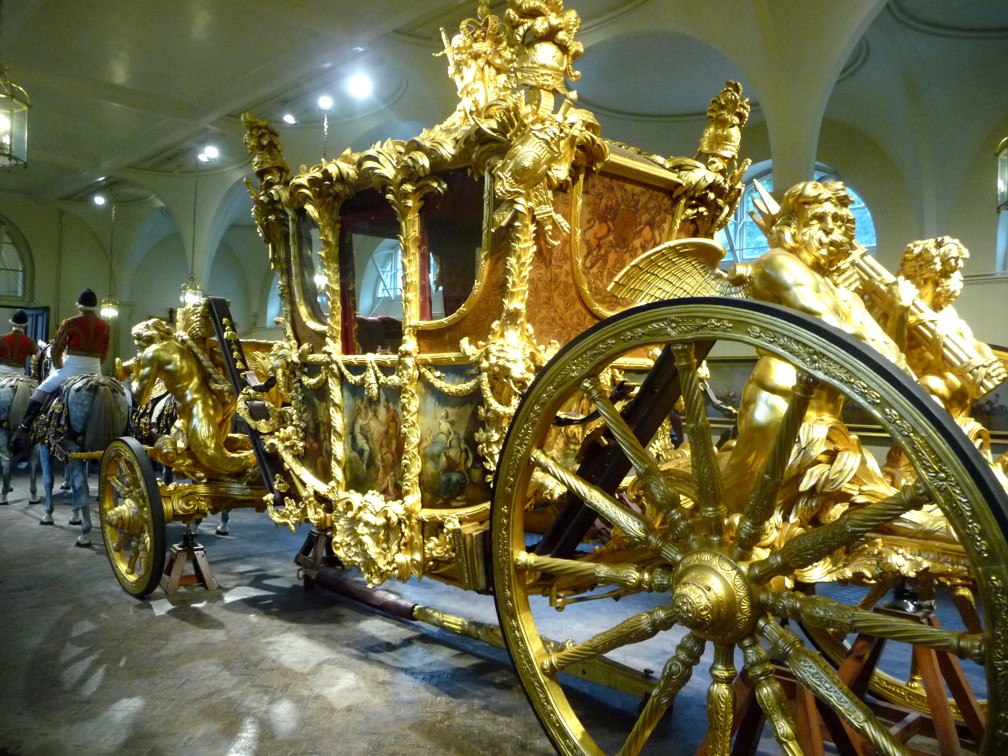 We toured the Royal Mews where they keep the royal cars, coaches, and horses. This gold leaf one weighs in at 8,000 lbs!