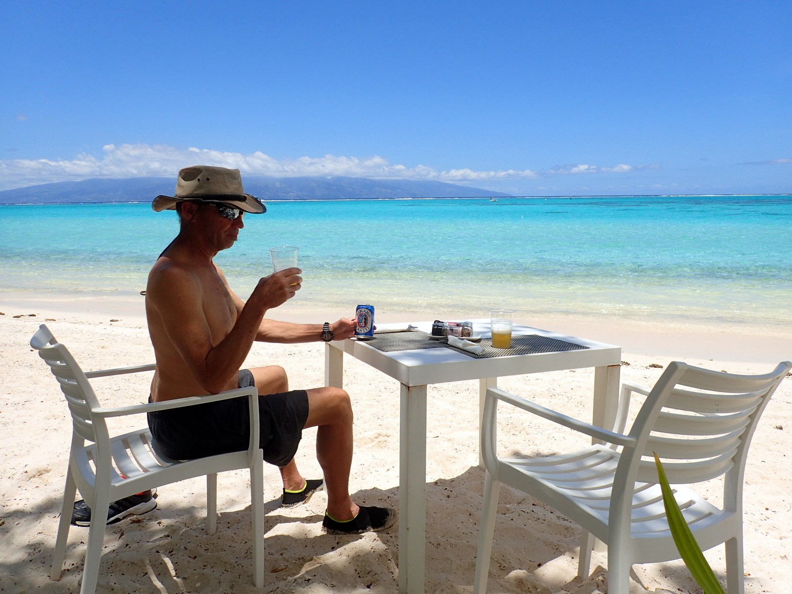 Having a beer and sandwiches on the beach at the Sofitel Hotel.