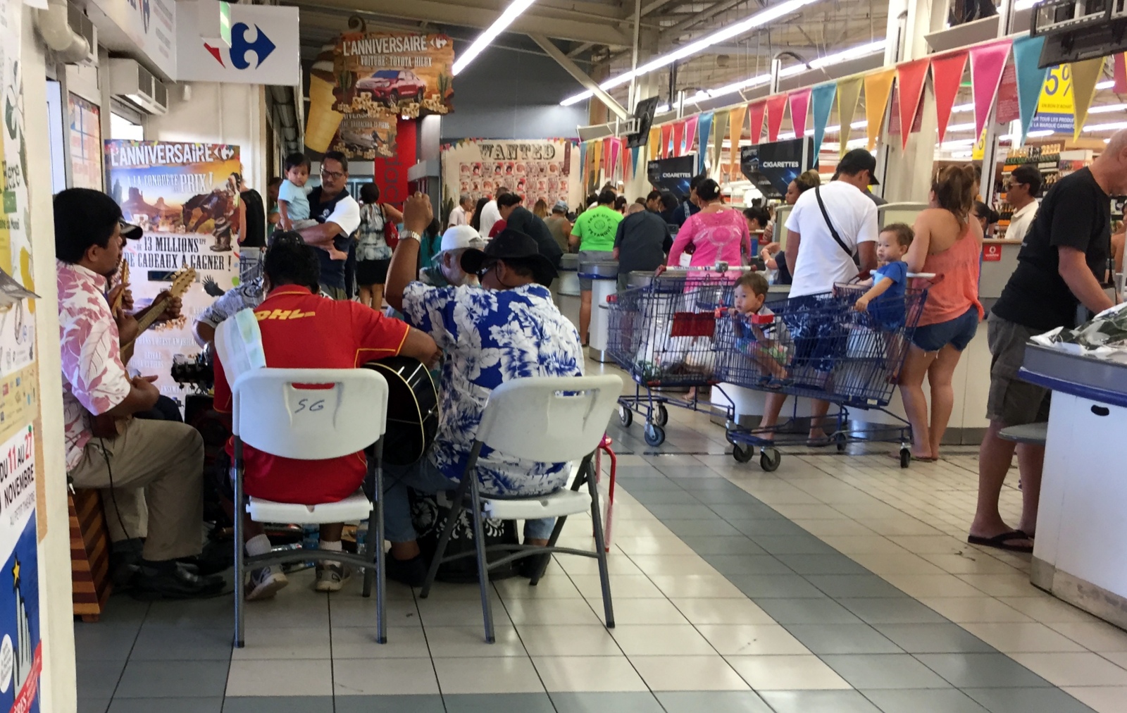 After a beer at a local resort, then another at the Papaeete Yacht Club, we decided to go the 'Carefore' supermarket to find something to take to our room. In the entrance, a local jam session! These people party EVERYWHERE.